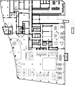 Plattegrond begane grond. A. Ingang. B. Centrale hal. C. Receptie. D. Koffiehoek. E. In- en uitgang parkeergarage. F. Fietsenstalling.